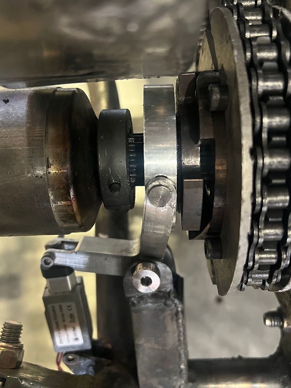 Dog clutch and fork installed against the drive sprocket, linear actuator below