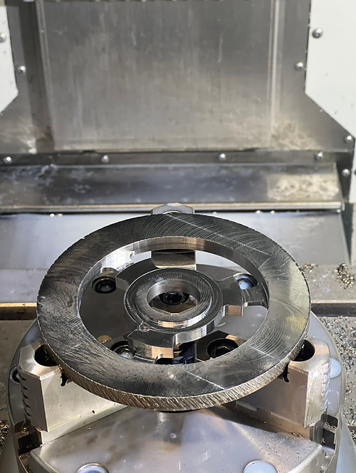 Machined clutch ring held in a CNC mill chuck