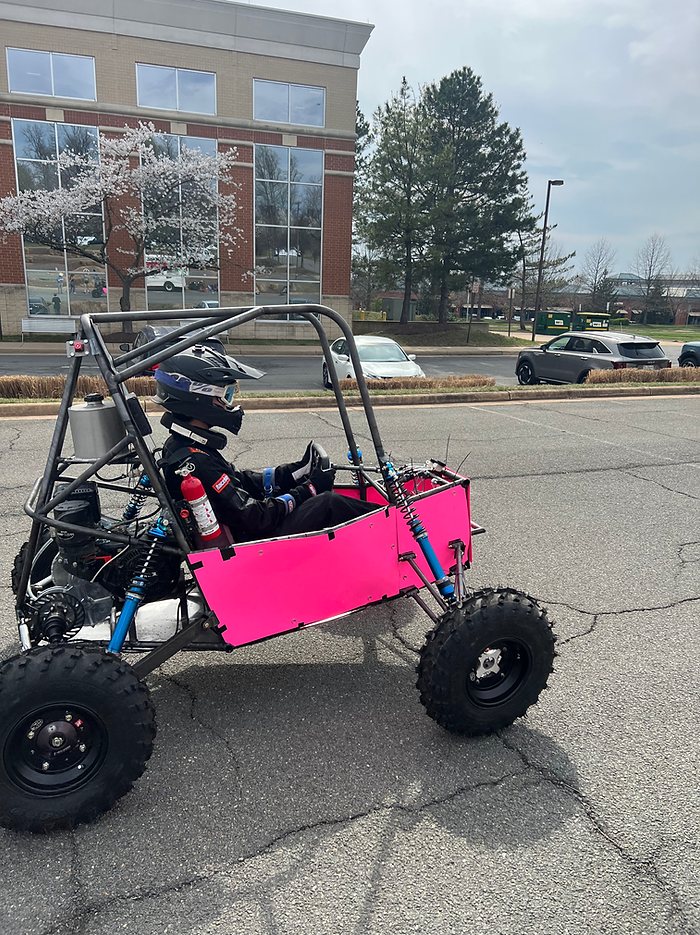Driver seated in the finished Baja car