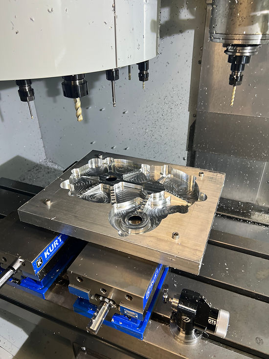 Gearbox housing on the CNC mill, pocketing in progress