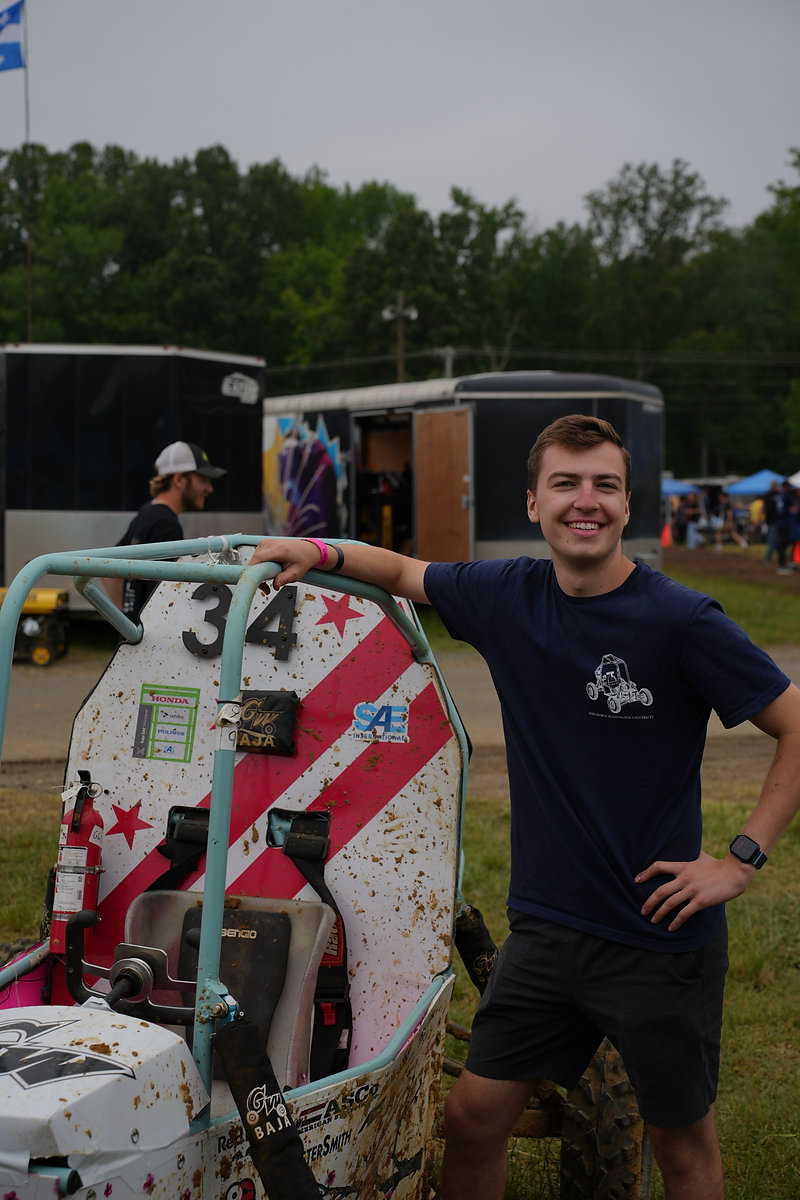Jacob Goldberg beside GW Baja car number 34