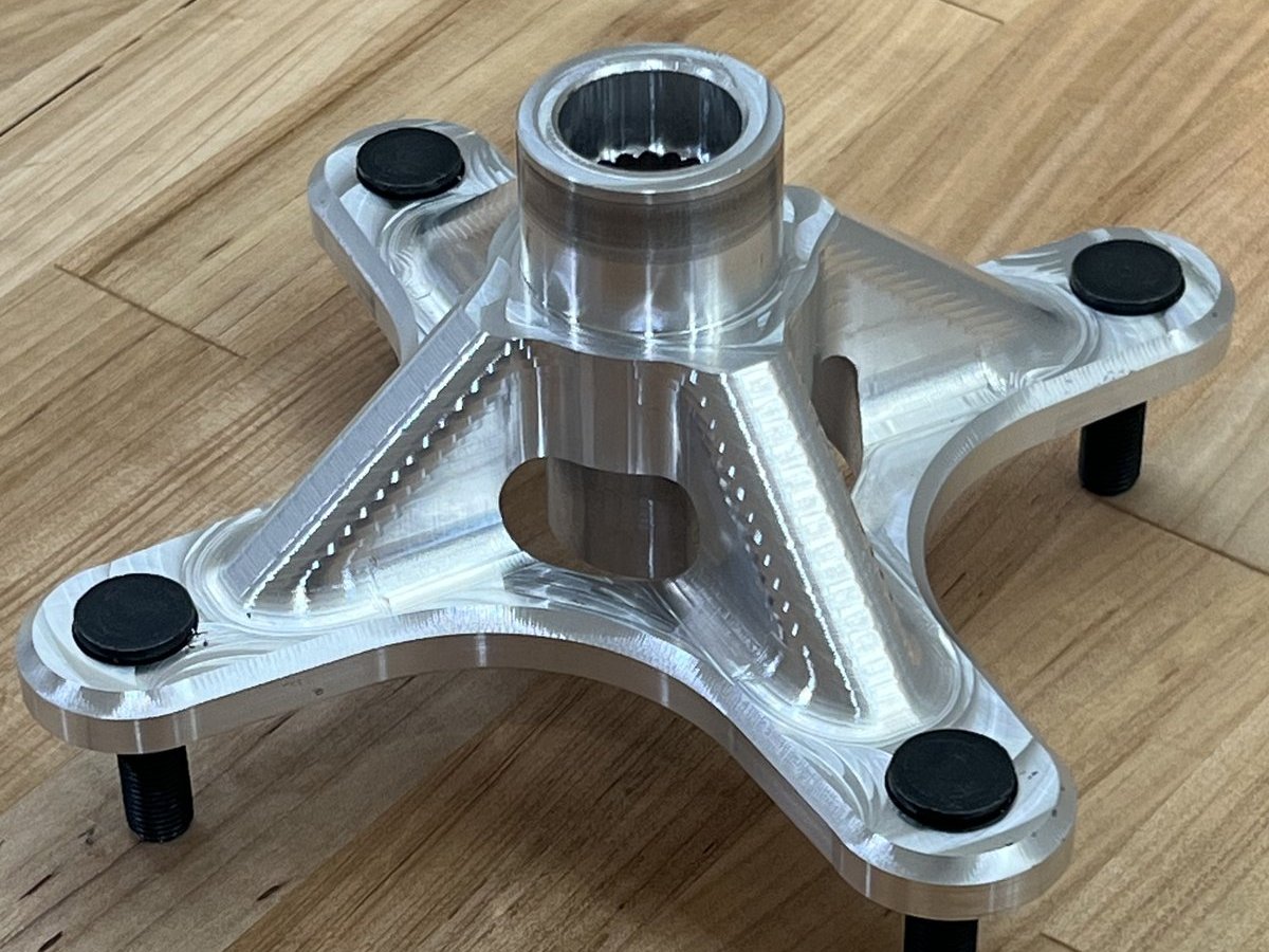 Machined single-piece 7075-T6 wheel hub with wheel studs installed