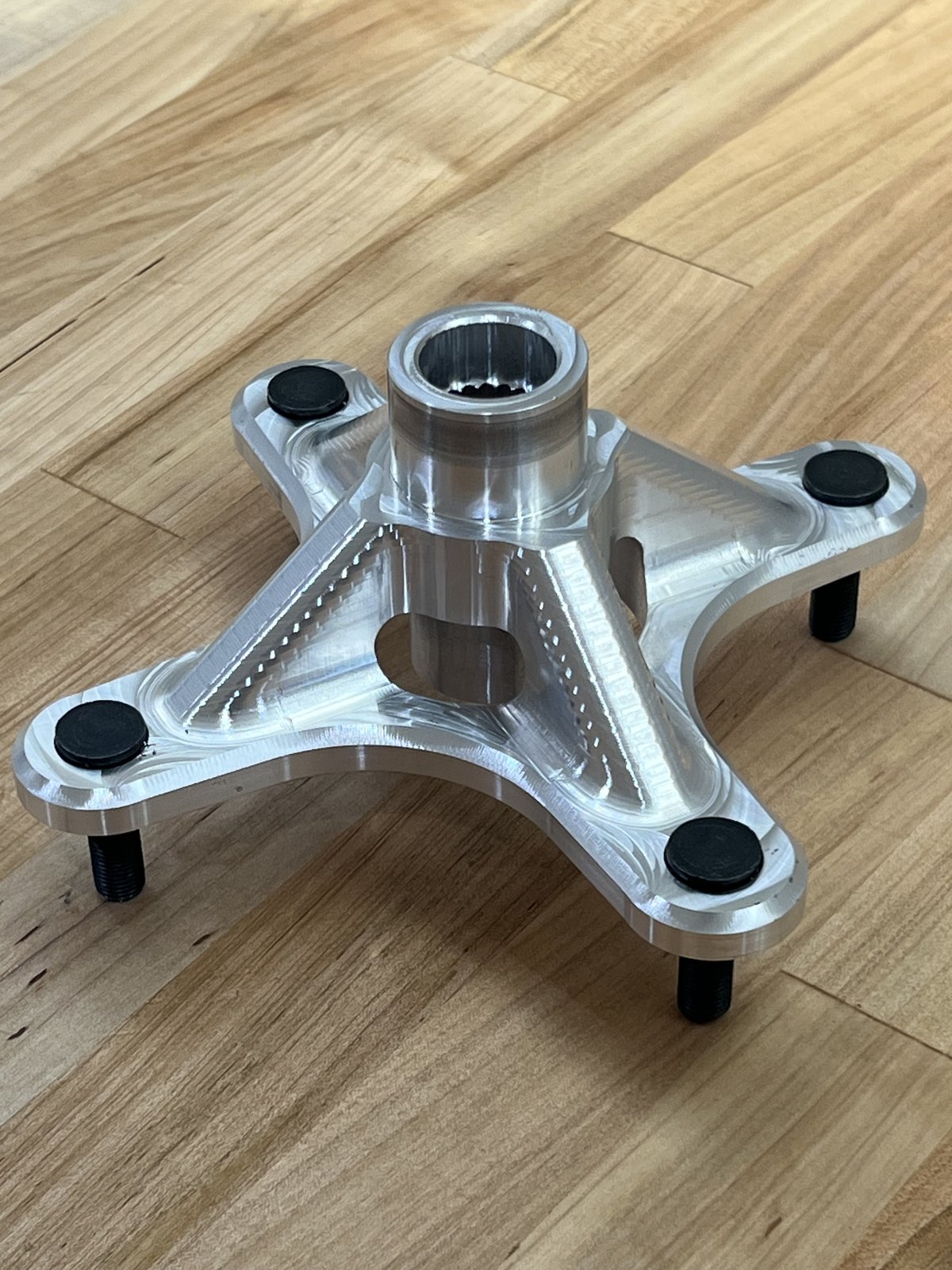 Machined single-piece wheel hub with wheel studs installed